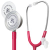A Greater Goods stethoscope with pink tubing and a stainless steel headset, featuring two readable heads and extra ear pieces.