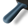 Close up of Greater Goods blue silicone handle cover on a Greater Goods cast iron handle. 
