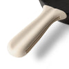 Close up of Greater Goods white silicone handle cover on a Greater Goods cast iron handle. 
