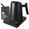 An electric gooseneck kettle with a matte black finish, placed on a black base, featuring a booklet that reads 