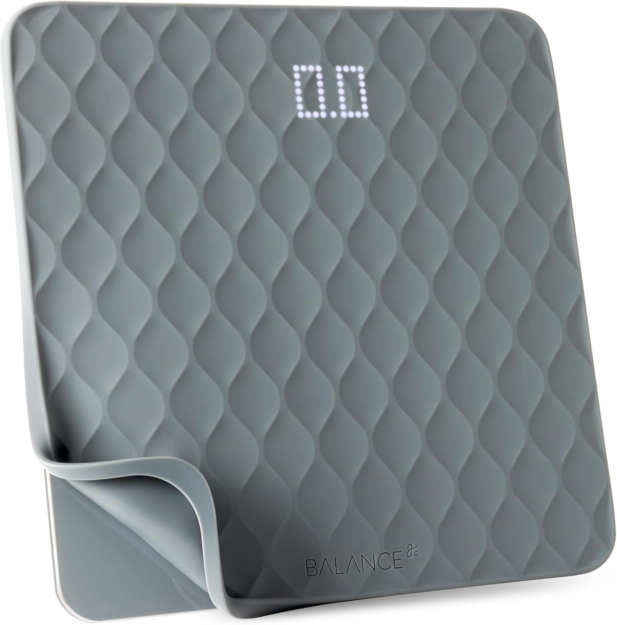Gray digital scale with textured surface and digital display on a white background