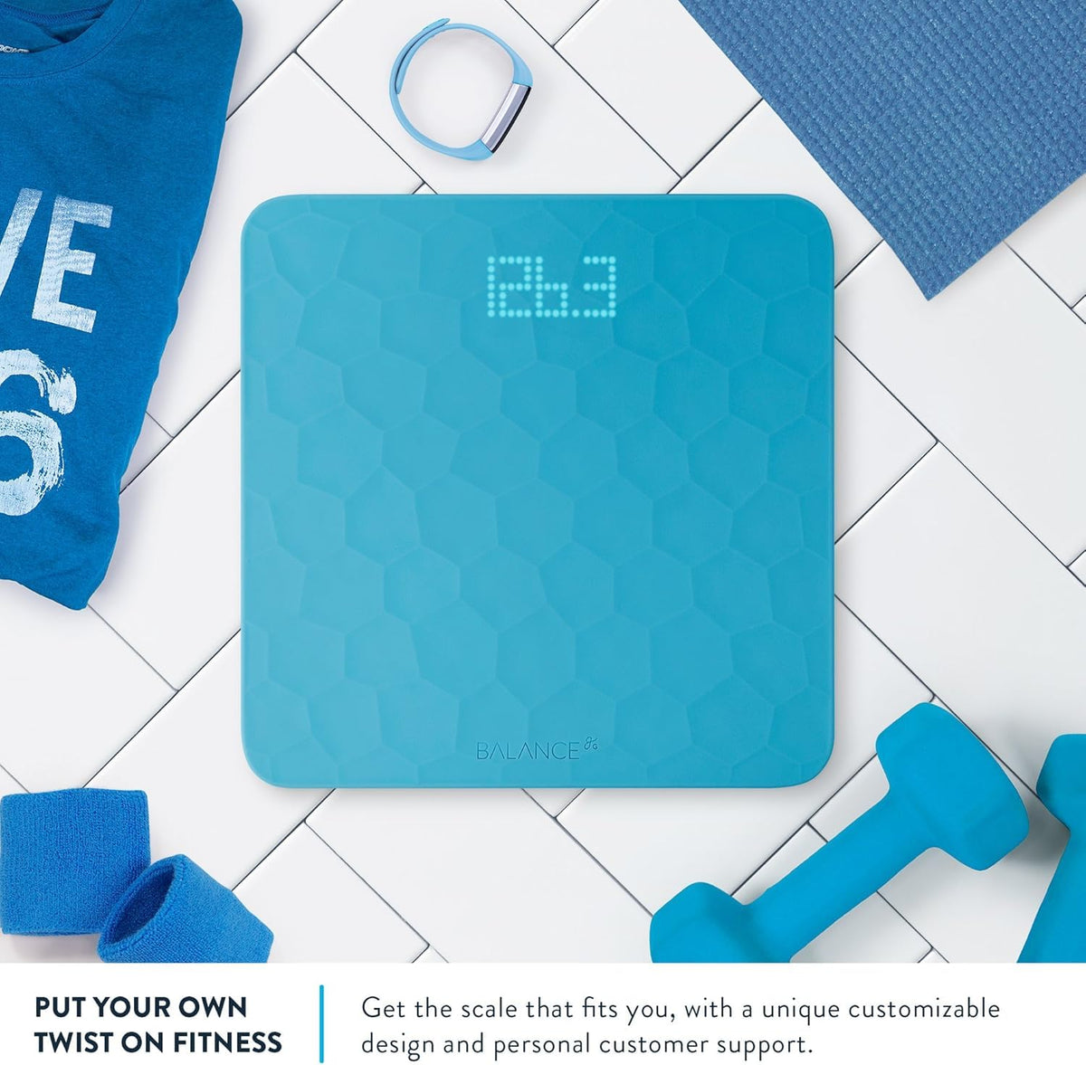 Blue digital scale on a tiled floor with fitness accessories around it.  Text reads, "Put your own twist on fitness: Get the scale that fits you, with a unique customizable design and personal customer support."